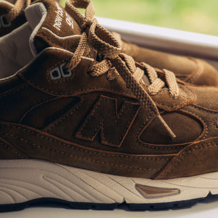 A close detailed view of a pair of New Balance Made in UK sneakers.