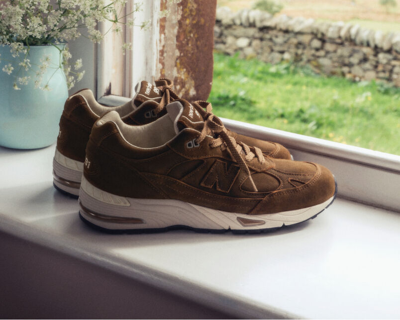 Close up view of a New Balance Made in UK sneaker tongue and laces.  
