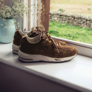 Close up view of a New Balance Made in UK sneaker tongue and laces.  
